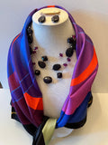 Silk Scarf in purple, blue and orange with shades of purple beaded necklace